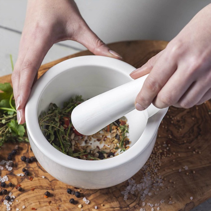 grinding spices with a mortar and pestle